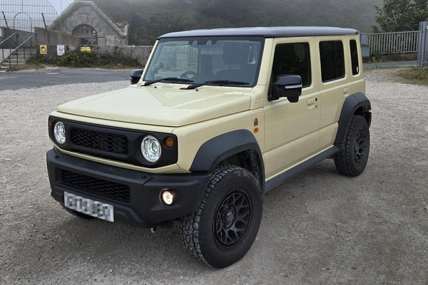 Chiffon Ivory Suzuki Jimny Nomade (5-door) with Magpie M-01 wheels and Retro Grille